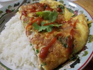 Kai jeow moo sab or nam (Thai wok-fried omelet)